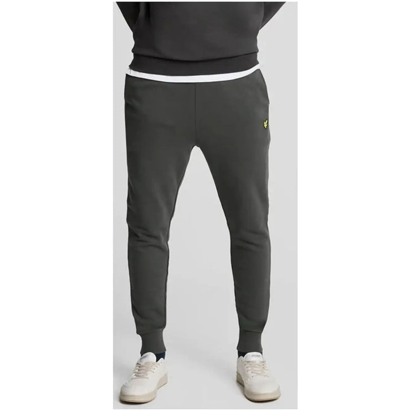 Lyle & Scott men’s grey cotton trousers with front pockets featuring a white waistband and yellow logo on the thigh