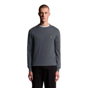 Lyle & Scott Pull en laine mérinos gris pour homme, col intérieur blanc et logo oiseau jaune, vue de face