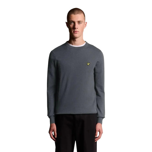 Lyle & Scott Pull en laine mérinos gris pour homme, col intérieur blanc et logo oiseau jaune, vue de face