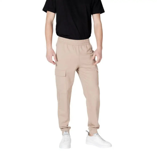 Man wearing Ea7 Men Beige Cotton Trousers suitable for Spring Summer fashion
