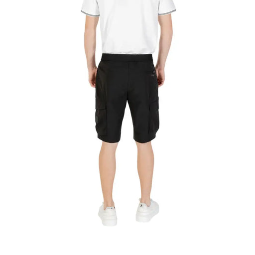 Man wearing Men’s Black Cargo Shorts showcasing durable and comfortable casual wear