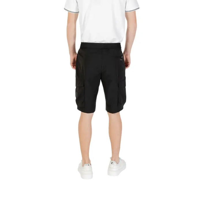 Man wearing Men’s Black Cargo Shorts showcasing durable and comfortable casual wear
