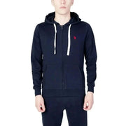 Man in U.S. Polo Assn. black hoodie and sweatpants highlighting urban style clothing