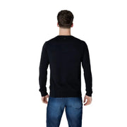 Man wearing Napapijri Men’s Black Cotton Round Neck Sweatshirt with blue jeans
