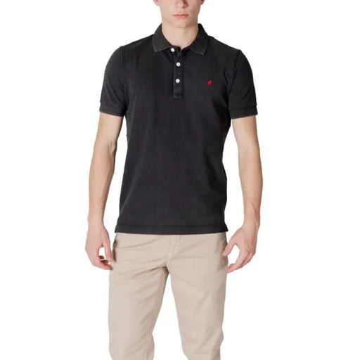 Man wearing a black polo shirt and khaki pants, showcasing Replay Men’s Yellow Polo Shirt