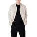 Man in black t-shirt and cargo pants wearing a Beige Overshirt for Men
