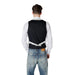 Man wearing a black vest and blue jeans in the Men Vest And Jeans Collection
