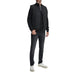 Man wearing black vest and jeans modeling the Black Ribbed Knit Sweater for Men