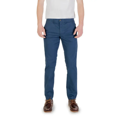 Man wearing blue chinos and brown shoes showcasing Men’s Khaki Chinos product