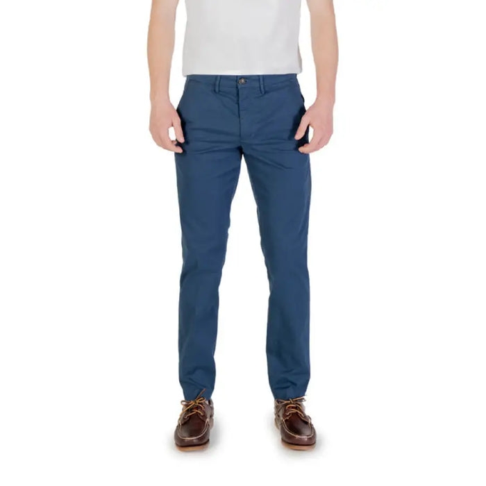 Man wearing blue chinos and brown shoes showcasing Men’s Khaki Chinos product
