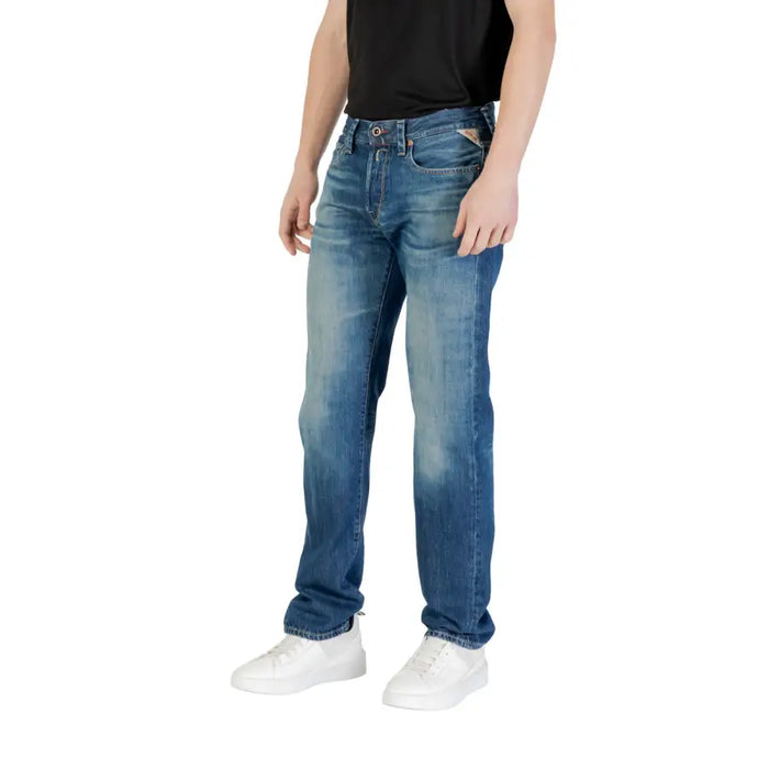 Man wearing Blue Denim Jeans and white sneakers showcasing casual fashion style