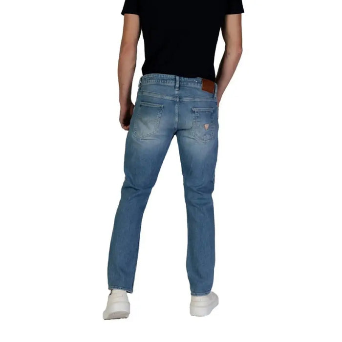 Man model showcasing Guess Men Blue Jeans from the Spring Summer Collection