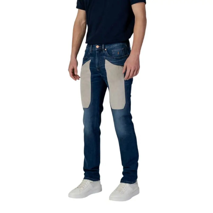 Man in blue jeans with beige patches from Jeckerson Men Spring Summer collection