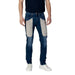 Man in Jeckerson Blue Jeans with Beige Patches for Spring Summer collection