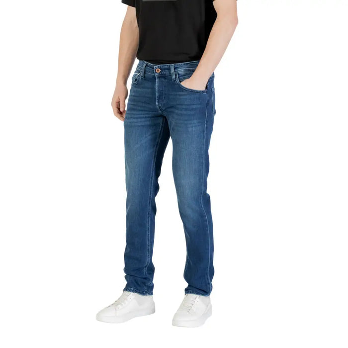 Mens Blue Denim Jeans featuring a man wearing white sneakers and blue jeans