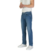 Man in blue jeans and white sneakers showcasing Replay Men’s Blue Jeans with Zip Closure