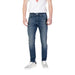Man wearing Tommy Hilfiger Men’s Blue Jeans with front and back pockets and white sneakers