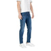 Man wearing blue jeans and white sneakers displayed in the product listing