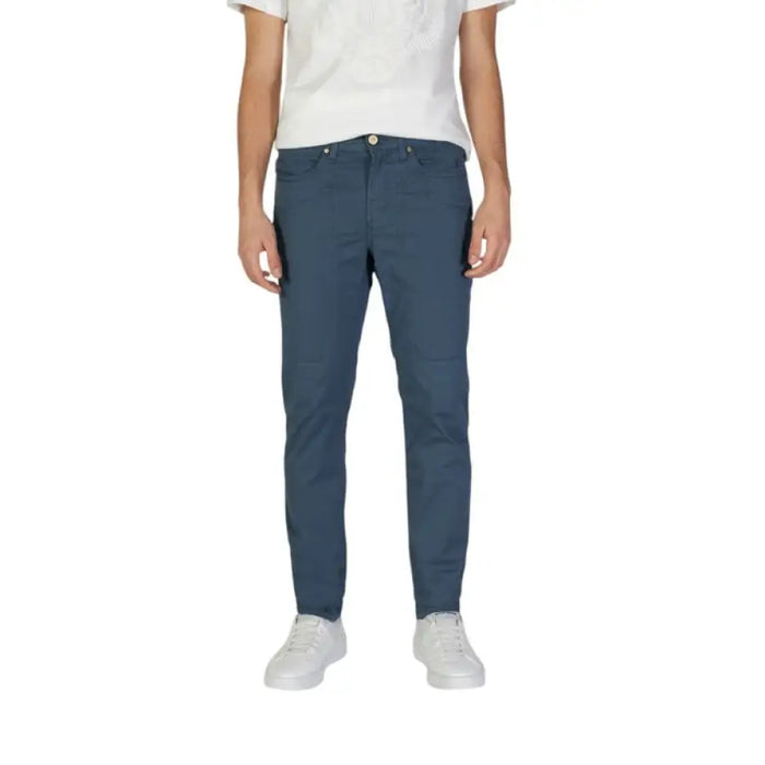 Man showcasing Jeckerson Mens Blue Cotton Trousers with stylish blue pants