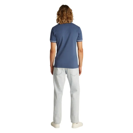 Man wearing Blue Polo Shirt with White Trim and Lightwash Jeans for Men