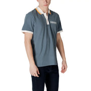 Man wearing a blue Napapijri Cotton Polo Shirt in a stylish setting
