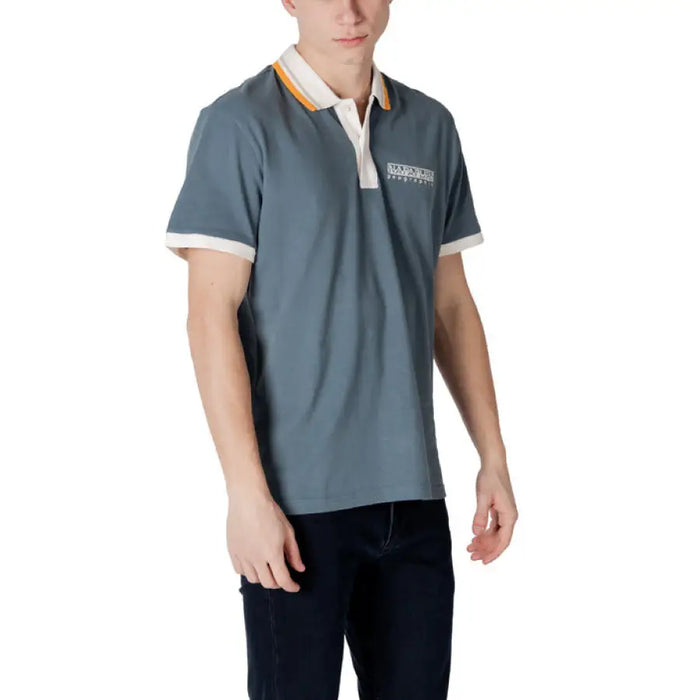 Man wearing a blue Napapijri Cotton Polo Shirt in a stylish setting