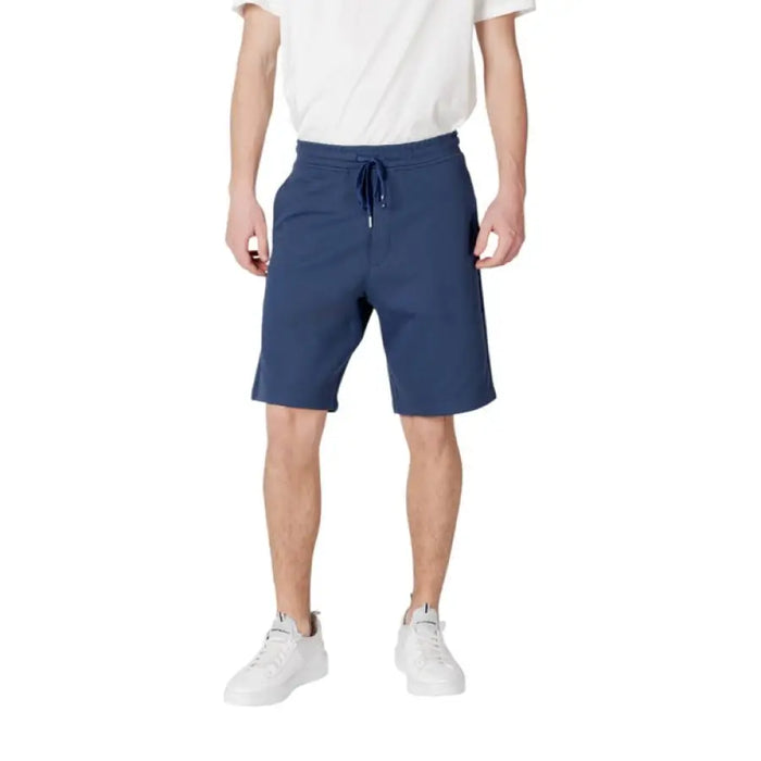 Man modeling blue drawstring shorts from Replay Beige Mens Shorts with Laces and Pockets