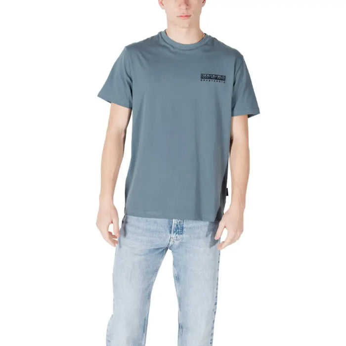 Man in a blue T-shirt and jeans wearing Napapijri Men T Shirt Black Print Slip On Round Neck