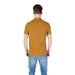 Man modeling a Replay Men’s Yellow Short Sleeve Polo Shirt with blue jeans