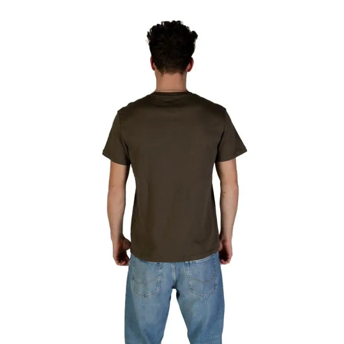 Man in brown t-shirt and blue jeans wearing Tommy Hilfiger Men’s Green Cotton T Shirt