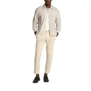 Man in casual beige shirt jacket with neutral-toned outfit displayed in Mens Beige Shirt Jacket