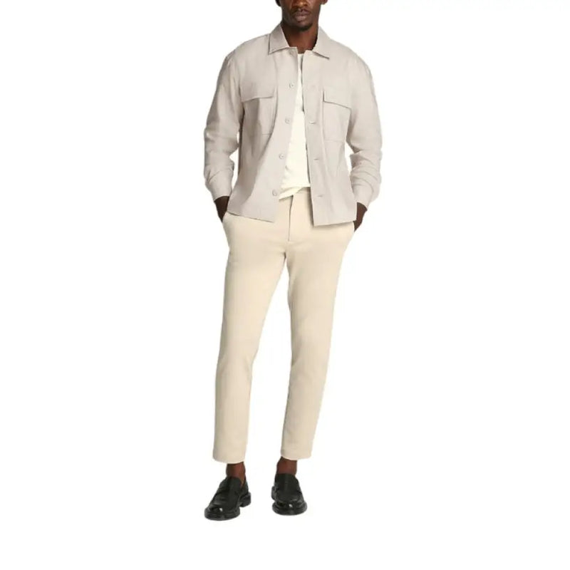 Man in casual beige shirt jacket with neutral-toned outfit displayed in Mens Beige Shirt Jacket