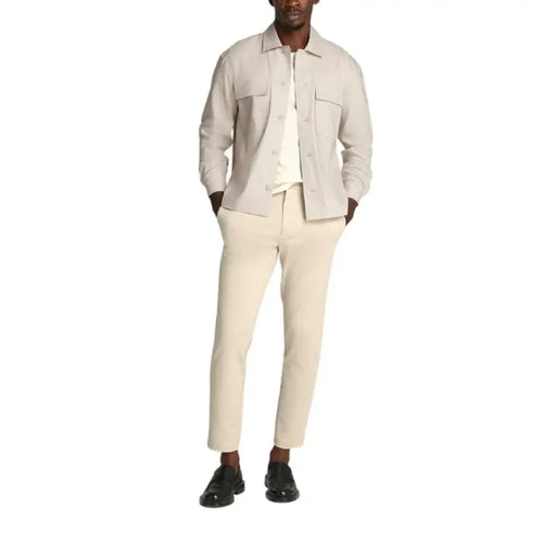 Man in casual beige shirt jacket with neutral-toned outfit displayed in Mens Beige Shirt Jacket