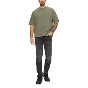 Man in casual attire wearing Gray Slim Fit Jeans for Men showcasing style and comfort