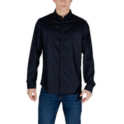 Man in dark blue mandarin collar shirt and jeans showcasing Armani Exchange White Shirt