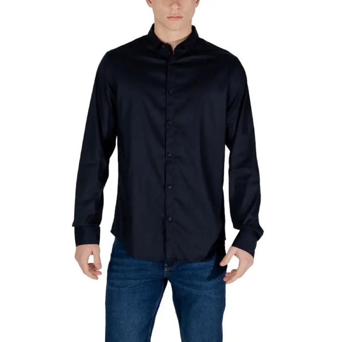 Man in dark blue mandarin collar shirt and jeans showcasing Armani Exchange White Shirt