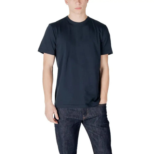 Man in dark blue t-shirt and jeans showcasing Colmar Originals Cotton Round Neck T-Shirt