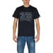 Man wearing navy blue graphic T-shirt and blue jeans for Men product display