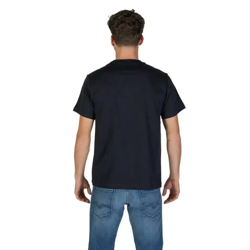 Man wearing a Navy Blue Graphic Tee for Men with blue jeans