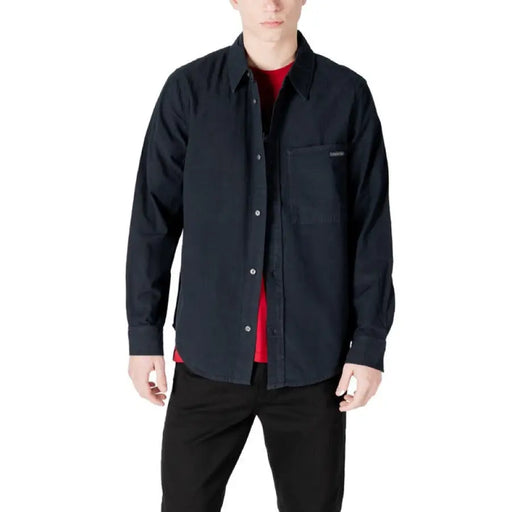 Man wearing a Mens Dark Button Down Shirt displaying a stylish dark button-down shirt for men