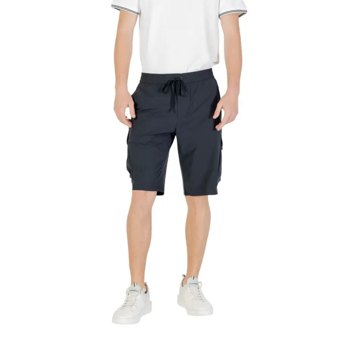 Man wearing Men’s Black Cargo Shorts showcasing durable athletic wear