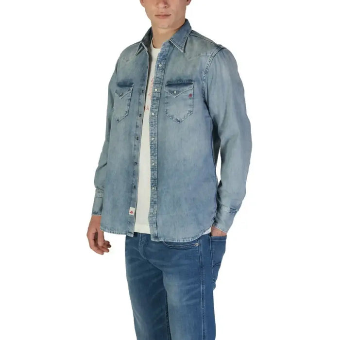 Man in denim shirt and jeans wearing Replay Men’s Classic Blue Long Sleeve Shirt