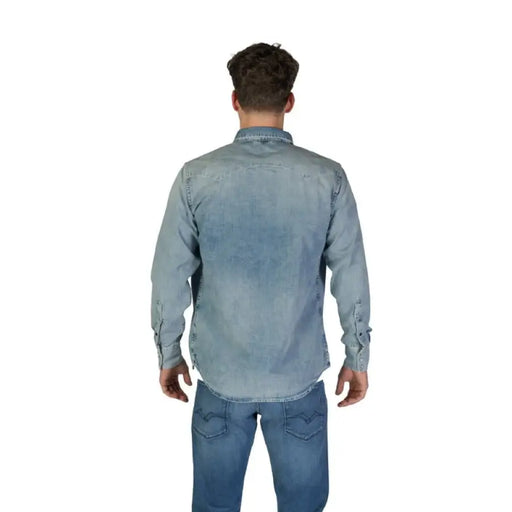 Man in denim shirt and jeans wearing Replay Men’s Classic Blue Long Sleeve Shirt