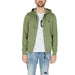 Man wearing U.S. Polo Assn. green hoodie from men sweatshirts apparel collection.