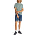 Man wearing a green T-shirt and denim shorts in a product display