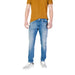 Man wearing jeans and a polo shirt from the Men’s Jeans and Polo Shirt Collection
