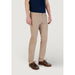 Man wearing khaki chinos and brown shoes showcasing men’s casual fashion