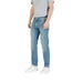 Man wearing light blue denim jeans and white sneakers showcasing Men’s Light Blue Denim Jeans