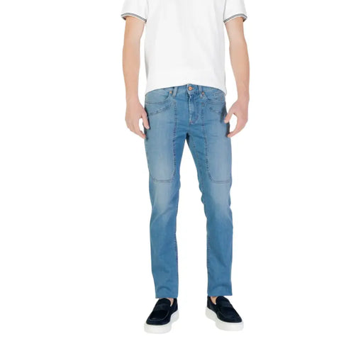 Man wearing light blue jeans and black slip-on shoes displayed in Men’s Light Blue Jeans and Black Slip-On Shoes product image