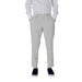 Man in light gray dress pants and black shoes from Men White Shirt and Gray Pants Apparel collection